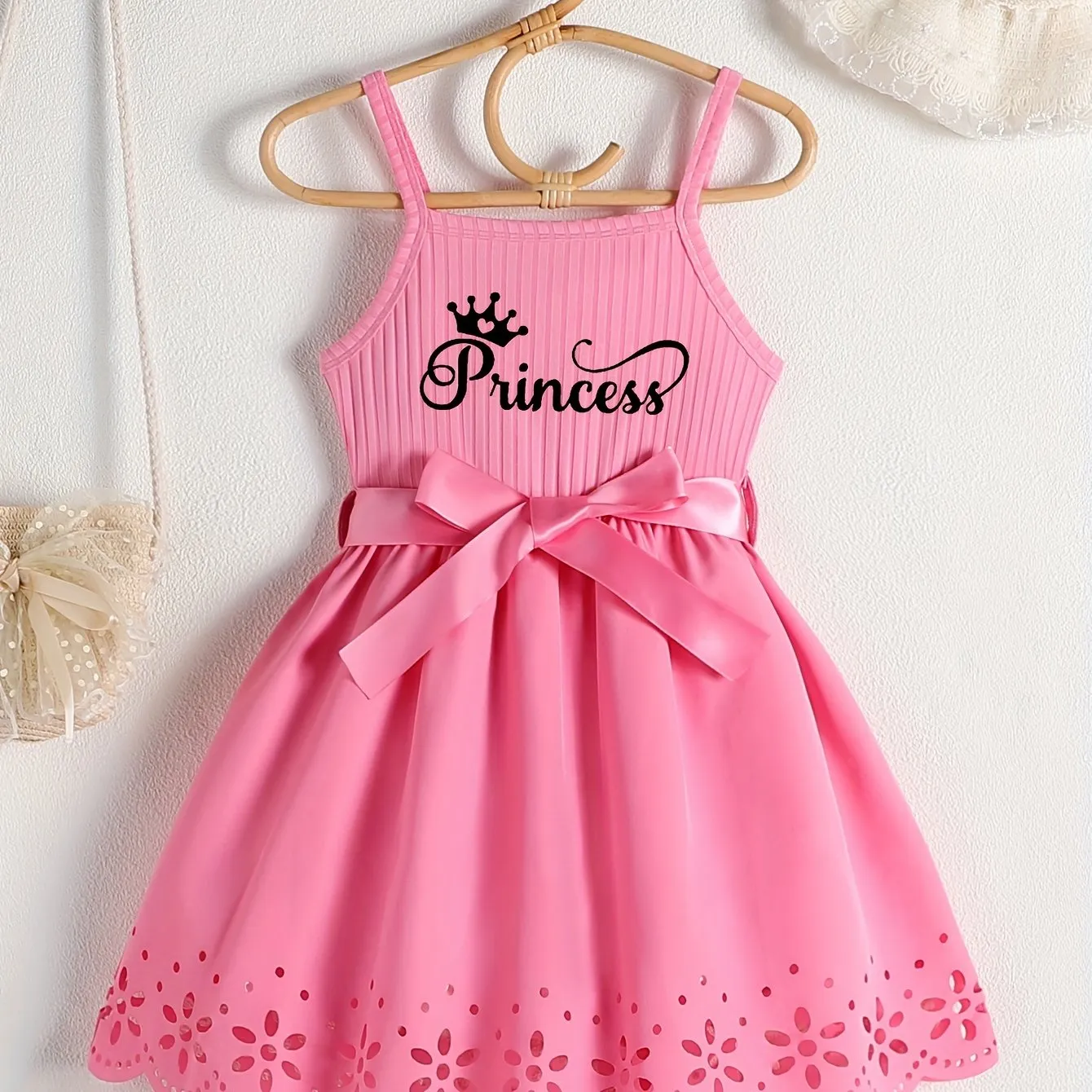 Girls Casual Summer Princess Alphabet Print Dress - Sleeveless Strappy Hollow Out Design, Bow Belt, Slight Stretch Polyester Fabric, Regular Fit, Knit Fabric, Perfect for Party Wear