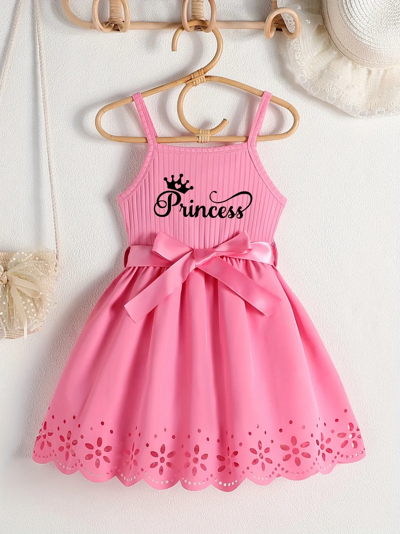 Girls Casual Summer Princess Alphabet Print Dress - Sleeveless Strappy Hollow Out Design, Bow Belt, Slight Stretch Polyester Fabric, Regular Fit, Knit Fabric, Perfect for Party Wear