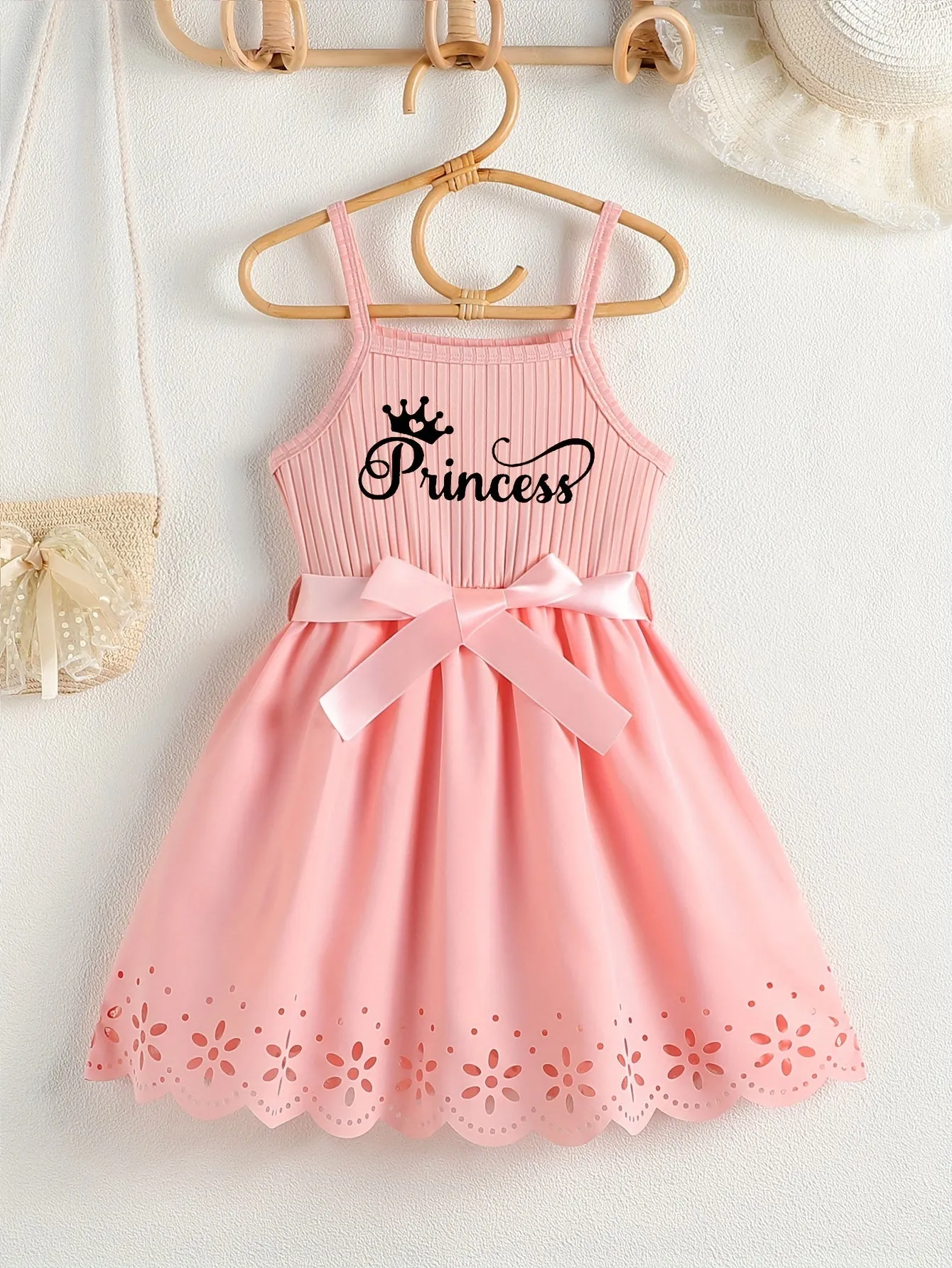 Girls Casual Summer Princess Alphabet Print Dress - Sleeveless Strappy Hollow Out Design, Bow Belt, Slight Stretch Polyester Fabric, Regular Fit, Knit Fabric, Perfect for Party Wear