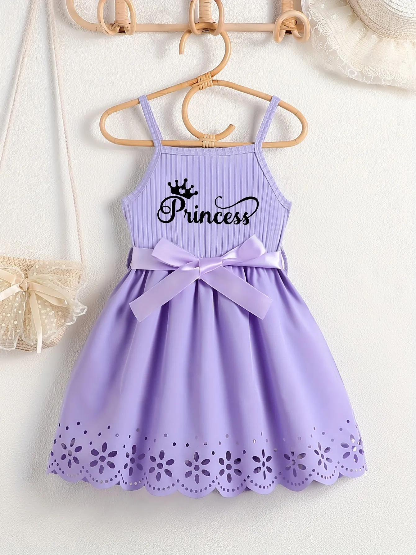 Girls Casual Summer Princess Alphabet Print Dress - Sleeveless Strappy Hollow Out Design, Bow Belt, Slight Stretch Polyester Fabric, Regular Fit, Knit Fabric, Perfect for Party Wear