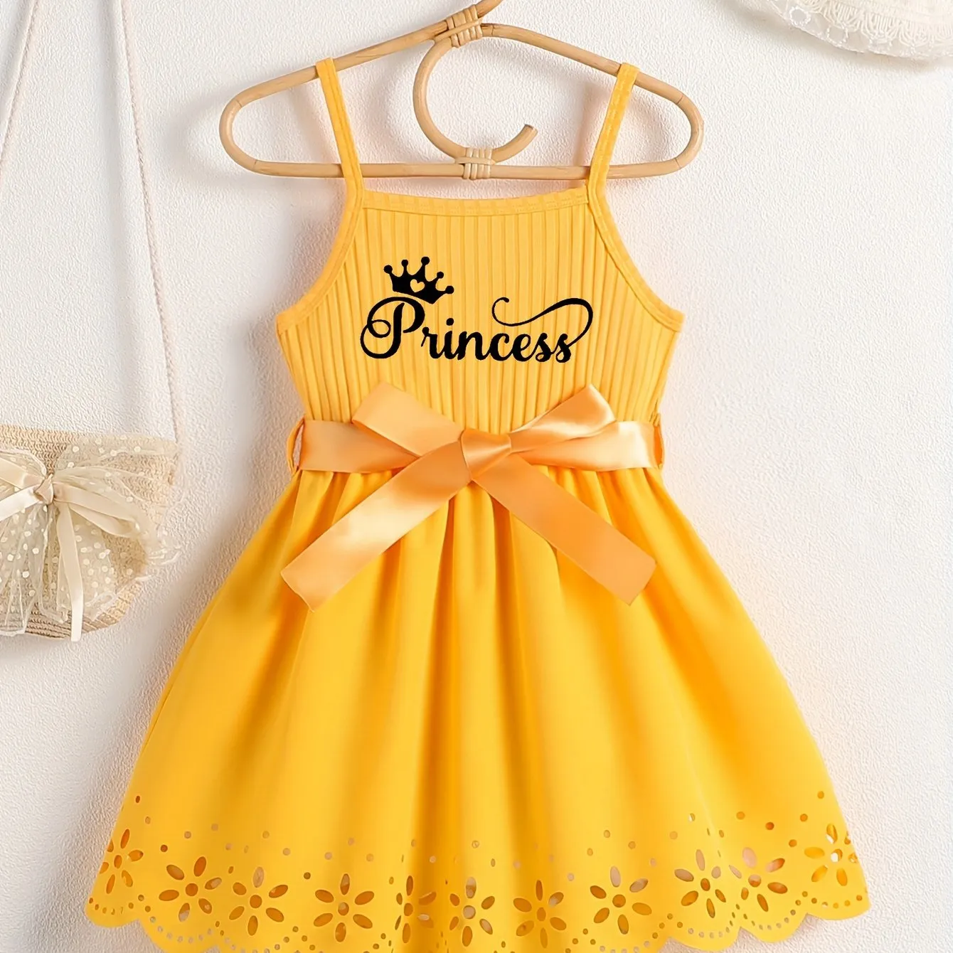 Girls Casual Summer Princess Alphabet Print Dress - Sleeveless Strappy Hollow Out Design, Bow Belt, Slight Stretch Polyester Fabric, Regular Fit, Knit Fabric, Perfect for Party Wear